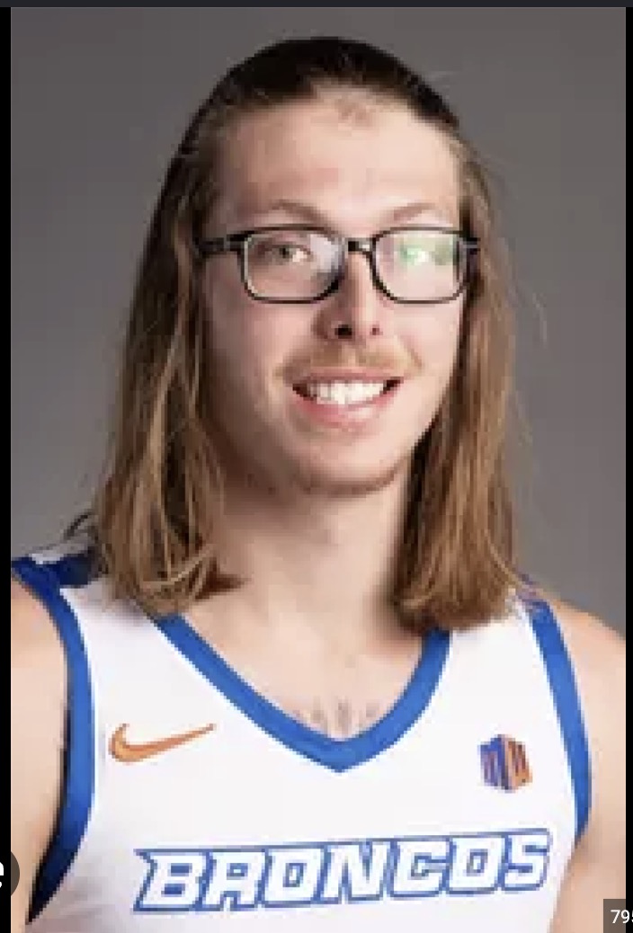Andrew Meadow at Boise State; long hair, glasses, big smile, an icon